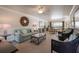 This large lobby has a sofa, chairs, coffee table, side table, and dining area at 5300 Gulf Dr # 204, Holmes Beach, FL 34217