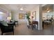 Comfortable lobby sitting area with chairs, desk, and potted plant at 5300 Gulf Dr # 204, Holmes Beach, FL 34217