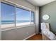 Picturesque ocean view from bedroom window, creating a serene and inviting ambiance with lots of natural light at 5300 Gulf Dr # 204, Holmes Beach, FL 34217