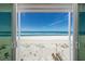 Breathtaking ocean view from a sliding glass door overlooking pristine sandy beach and crystal blue waters at 5300 Gulf Dr # 204, Holmes Beach, FL 34217