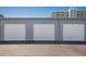 Three storage units with garage-style doors offer ample space at 5300 Gulf Dr # 204, Holmes Beach, FL 34217