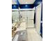Bathroom featuring double sinks, a glass-enclosed shower, and a plush rug at 5360 Davini St, Sarasota, FL 34238