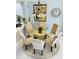 Cozy dining area with a round glass table and seating for six at 5360 Davini St, Sarasota, FL 34238