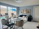 Open living area with sliding glass doors leading to a pool, plus cozy seating at 5360 Davini St, Sarasota, FL 34238
