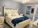 Relaxing bedroom with a queen-sized bed and coastal-themed decor at 5360 Davini St, Sarasota, FL 34238