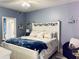 Comfortable main bedroom featuring a queen bed and a bathroom en suite at 5360 Davini St, Sarasota, FL 34238
