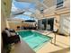Screened-in pool with comfortable seating and ample room for entertaining at 5360 Davini St, Sarasota, FL 34238