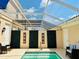 Enclosed pool area featuring comfortable seating, a privacy screen, and a clear view of the sky at 5360 Davini St, Sarasota, FL 34238