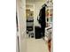 Well-organized walk-in closet with shelving, rods for hanging clothes and a file cabinet for optimum storage at 5360 Davini St, Sarasota, FL 34238