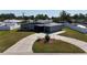An aerial view of the well-maintained house with a circular driveway at 5727 25Th W St, Bradenton, FL 34207
