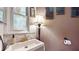 Bathroom showcasing a stylish vanity with patterned tiles and decorative lighting, blending vintage with modern style at 5727 25Th W St, Bradenton, FL 34207
