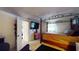 A room features a four-poster bed and a TV on the wall, blending relaxation and entertainment at 5727 25Th W St, Bradenton, FL 34207