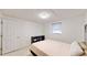 This bedroom features neutral walls, a single window, and a minimalist shelf at 5727 25Th W St, Bradenton, FL 34207