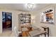 Bright dining area with a wooden table next to the open kitchen at 5727 25Th W St, Bradenton, FL 34207