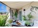 Charming front porch with plants and decorative elements enhancing curb appeal at 5727 25Th W St, Bradenton, FL 34207