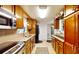Efficient kitchen with wood cabinets, granite counters, and stainless appliances at 5727 25Th W St, Bradenton, FL 34207