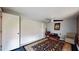 Relaxing sitting room features ample lighting, a vintage rug, and calming paint tones to create an inviting space at 5727 25Th W St, Bradenton, FL 34207