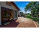 Inviting back deck accessible through double doors, perfect for outdoor relaxation and entertaining at 60 Liles St, Terra Ceia, FL 34250