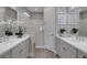 Well-lit bathroom featuring double sinks, contemporary cabinets, and a walk-in shower at 6255 Cassia St, Bradenton, FL 34203