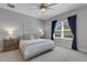 Serene bedroom with a large window, neutral tones, and plush carpeting for a cozy feel at 6255 Cassia St, Bradenton, FL 34203