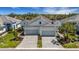 Charming home featuring a well-manicured lawn, paver driveway, and two-car garage at 6255 Cassia St, Bradenton, FL 34203
