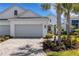 Charming single Gathering home with a large two car garage, beautiful landscaping, and striking curb appeal at 6255 Cassia St, Bradenton, FL 34203