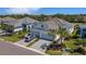 Charming single-Gathering home with a paver driveway, two-car garage, and beautifully landscaped front yard with palm trees at 6255 Cassia St, Bradenton, FL 34203