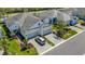 Home with a two-car garage, paved driveway, and lush landscaping at 6255 Cassia St, Bradenton, FL 34203