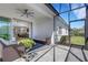 Screened lanai with comfortable seating and view into living spaces through sliding doors at 6255 Cassia St, Bradenton, FL 34203