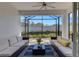 Beautiful screened-in lanai featuring comfortable seating and view of backyard at 6255 Cassia St, Bradenton, FL 34203