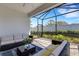 The covered lanai includes comfortable seating and access to the backyard at 6255 Cassia St, Bradenton, FL 34203