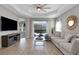 Bright living room features a large sectional sofa and a view to the backyard patio at 6255 Cassia St, Bradenton, FL 34203