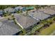 Aerial view of home with a screened-in lanai and well-maintained lawn at 6255 Cassia St, Bradenton, FL 34203