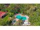 Aerial view showcases a community pool, hot tub and lush landscape at 6407 Quail Hollow Pl, Bradenton, FL 34210