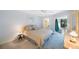 Cozy bedroom featuring carpet flooring, a ceiling fan, and French doors leading to the outdoor area at 6407 Quail Hollow Pl, Bradenton, FL 34210