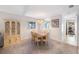 The dining room features a chandelier, built-in cabinet, and access to the kitchen at 6407 Quail Hollow Pl, Bradenton, FL 34210