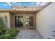 Covered entrance featuring decorative glass door and brick-paved entrance way at 6407 Quail Hollow Pl, Bradenton, FL 34210