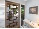 A decorative glass front door and a small table with a lamp at 6407 Quail Hollow Pl, Bradenton, FL 34210