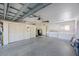 Attached garage with epoxy floor, washer, dryer, folding door storage, work benches, and ample storage space at 6407 Quail Hollow Pl, Bradenton, FL 34210