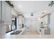 Clean kitchen featuring white cabinets, updated appliances, and bright lighting at 6407 Quail Hollow Pl, Bradenton, FL 34210