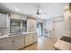 Bright, clean kitchen featuring white cabinets and appliances, with a breakfast nook at 6407 Quail Hollow Pl, Bradenton, FL 34210