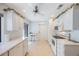 Well-lit kitchen with modern appliances, white cabinets, and a breakfast area at 6407 Quail Hollow Pl, Bradenton, FL 34210