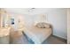 Main bedroom with neutral decor, soft lighting, and an ensuite bathroom at 6407 Quail Hollow Pl, Bradenton, FL 34210