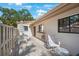 This patio features lovely brick pavers with ample seating, a patio table and is surrounded by beautiful greenery at 6407 Quail Hollow Pl, Bradenton, FL 34210