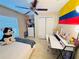 Bedroom with a work space and an accent flag on the wall at 7114 Hamilton Park Blvd, Tampa, FL 33615