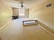 Bedroom featuring neutral walls, carpeted floors, a ceiling fan, and a window with blinds at 7114 Hamilton Park Blvd, Tampa, FL 33615