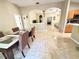 Spacious dining room with views into the living room, kitchen, and other living areas at 7114 Hamilton Park Blvd, Tampa, FL 33615