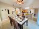 Open-concept dining area with views of the kitchen and living room at 7114 Hamilton Park Blvd, Tampa, FL 33615