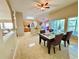 Open-concept dining room with views of the kitchen and living spaces at 7114 Hamilton Park Blvd, Tampa, FL 33615