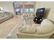 A bright and spacious living area featuring tile floors with easy access to the kitchen at 7114 Hamilton Park Blvd, Tampa, FL 33615